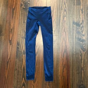 Lululemon Speed Up Tight navy leggings with pockets. Size 2